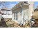 Backyard view with stone patio, windows, and siding at 3509 Archdale Dr, Raleigh, NC 27614
