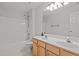 Bright bathroom featuring double vanity and a shower/tub combo at 3509 Archdale Dr, Raleigh, NC 27614