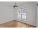 Dining room with natural light, wood-look floors, and an elegant light fixture at 3509 Archdale Dr, Raleigh, NC 27614