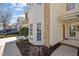 Exterior view showcasing brick and siding with manicured landscaping at 3509 Archdale Dr, Raleigh, NC 27614