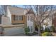 Elevated view showcasing brick accents, bay window, and mature trees at 3509 Archdale Dr, Raleigh, NC 27614