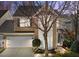 Inviting two-story brick home with a well-manicured lawn and attached two-car garage at 3509 Archdale Dr, Raleigh, NC 27614