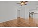 Open concept living room with hardwood floors and views of the kitchen at 3509 Archdale Dr, Raleigh, NC 27614