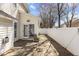 Cozy patio with stone flooring and a white fence at 3509 Archdale Dr, Raleigh, NC 27614