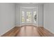 Cozy sun room with hardwood floors and large windows at 3509 Archdale Dr, Raleigh, NC 27614