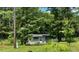Charming home nestled among lush trees, offering a private and tranquil setting at 3541 Holden Acres Dr, Wendell, NC 27591