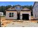 Exterior view of a new construction home with covered entry and attached garage at 362 Bluejay St, Clayton, NC 27520