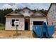 New construction featuring a modern design, visible window frames, and durable exterior wrap on a sunny day at 362 Bluejay St, Clayton, NC 27520