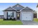 Charming single-story home with a gray facade, well-manicured lawn, and a one-car garage at 362 Bluejay St, Clayton, NC 27520