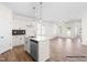 Bright, modern kitchen featuring white cabinets, stainless steel appliances, and hardwood floors at 362 Bluejay St, Clayton, NC 27520