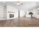 Spacious living room with fireplace and adjoining kitchen provides an open concept feel at 362 Bluejay St, Clayton, NC 27520