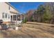 Expansive backyard with a view of mature trees and a well-manicured lawn at 3708 Tansley St, Wake Forest, NC 27587