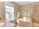 Relaxing bathroom featuring a soaking tub, granite countertop, and a glass shower at 3708 Tansley St, Wake Forest, NC 27587