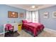 Cozy bedroom with blue walls, desk, and plush bed for comfortable living and relaxation at 3708 Tansley St, Wake Forest, NC 27587