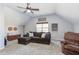 Spacious bonus room with cozy seating, neutral carpet and ceiling fan with overhead lighting at 3708 Tansley St, Wake Forest, NC 27587