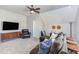 Inviting bonus room with comfortable seating, mounted TV and a ceiling fan with overhead lighting at 3708 Tansley St, Wake Forest, NC 27587