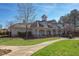 Exterior shot of clubhouse showcasing well-manicured landscaping, inviting entrance, and elegant architectural details at 3708 Tansley St, Wake Forest, NC 27587