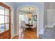 Elegant dining room featuring hardwood floors, a chandelier, and an archway entrance at 3708 Tansley St, Wake Forest, NC 27587