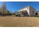 Home exterior with screened porch and extensive backyard offering space for relaxation and outdoor enjoyment at 3708 Tansley St, Wake Forest, NC 27587