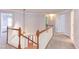 Bright hallway with white wainscotting and a staircase featuring wood handrail and white painted balusters at 3708 Tansley St, Wake Forest, NC 27587