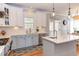 Bright kitchen features stainless steel appliances, an island, and beautiful two-tone cabinetry at 3708 Tansley St, Wake Forest, NC 27587