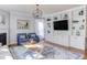Living room view showcasing custom built-in shelving, fireplace, and stylish decor at 3708 Tansley St, Wake Forest, NC 27587