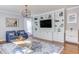 Open-concept living room design with built-in shelves and decorative lighting at 3708 Tansley St, Wake Forest, NC 27587