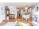 Open floor plan featuring a combined kitchen, dining, and living area with hardwood flooring at 3708 Tansley St, Wake Forest, NC 27587