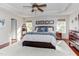 Spacious main bedroom with tray ceiling, hardwood floors, and natural light at 3708 Tansley St, Wake Forest, NC 27587