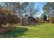 Community playground featuring a slide, swing set, and lush greenery, ideal for Gathering fun and outdoor recreation at 3708 Tansley St, Wake Forest, NC 27587