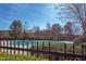 Fenced community pool with clear water and surrounding trees, perfect for relaxation and leisure activities at 3708 Tansley St, Wake Forest, NC 27587