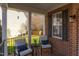 Relaxing front porch featuring comfortable seating and a view of the surrounding landscape at 3708 Tansley St, Wake Forest, NC 27587