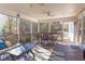 Spacious screened porch with a dining table set, perfect for outdoor meals and gatherings at 3708 Tansley St, Wake Forest, NC 27587