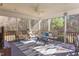Relaxing screened porch with comfortable seating and a view of the outdoor landscape at 3708 Tansley St, Wake Forest, NC 27587