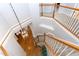 Staircase design with wooden banisters and carpeted steps, illuminated by decorative lighting at 3708 Tansley St, Wake Forest, NC 27587