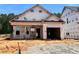 New construction featuring an attached two-car garage and covered entry on a sunny lot at 378 Bluejay St, Clayton, NC 27520