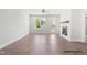 Bright living room with modern fireplace, ceiling fan, and access to the outdoor patio at 378 Bluejay St, Clayton, NC 27520