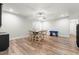 Dining area featuring hardwood flooring, a ceiling fan, and windows for natural light at 3847 Stoneridge Forest Dr, Raleigh, NC 27612