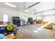 Spacious garage with an abundance of space for vehicles, projects, and storage at 3847 Stoneridge Forest Dr, Raleigh, NC 27612