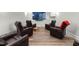 Home theater with recliners facing a large flat screen television at 3847 Stoneridge Forest Dr, Raleigh, NC 27612