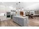 Spacious kitchen boasts a large center island, stainless appliances, and an open layout to the living area at 3847 Stoneridge Forest Dr, Raleigh, NC 27612