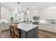 Kitchen with a gray island and stainless steel appliances at 3847 Stoneridge Forest Dr, Raleigh, NC 27612