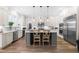 Beautiful kitchen featuring a center island, stainless steel appliances, and white cabinetry at 3847 Stoneridge Forest Dr, Raleigh, NC 27612