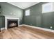 Cozy living room featuring a fireplace, providing a comfortable and inviting atmosphere with neutral wall color at 3847 Stoneridge Forest Dr, Raleigh, NC 27612