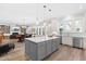 Open-concept layout combining the kitchen, dining, and living areas, ideal for entertaining at 3847 Stoneridge Forest Dr, Raleigh, NC 27612