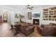 Spacious living room features a fireplace, custom built-ins, and comfortable seating at 3847 Stoneridge Forest Dr, Raleigh, NC 27612