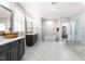 Spacious main bathroom with double vanity, soaking tub, large shower, and great natural light at 3847 Stoneridge Forest Dr, Raleigh, NC 27612