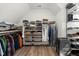 Spacious walk-in closet with custom shelving, wooden floors, and ample storage space for clothes and accessories at 3847 Stoneridge Forest Dr, Raleigh, NC 27612