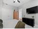 Comfortable bedroom with plenty of storage space, a TV, ceiling fan, and natural light at 400 W North St # 1204, Raleigh, NC 27603