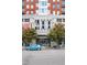 Exterior of building with decorative building number and landscaping at 400 W North St # 1204, Raleigh, NC 27603